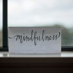 Coaching Leadership - mindfulness printed paper near window