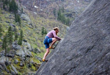 Risks - Man Climbing on Rock Mountain