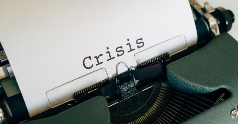Crisis Management Plan - White Paper On A Vintage Typewriter