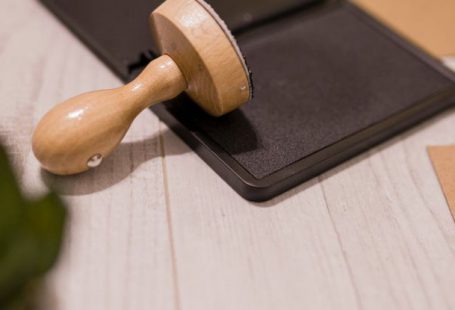 Authority - Wooden stamp on ink pad placed on desk