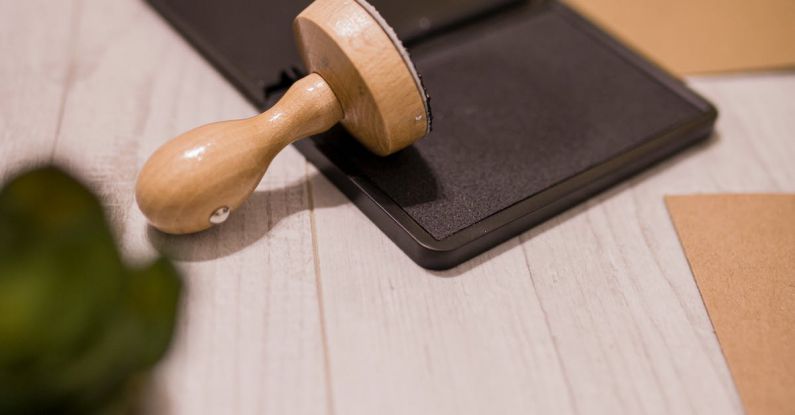 Authority - Wooden stamp on ink pad placed on desk