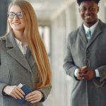 Diverse Corporate Board - Cheerful business people with passport in airport hall