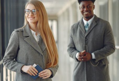 Diverse Corporate Board - Cheerful business people with passport in airport hall