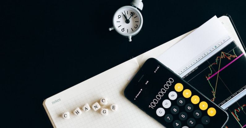 Enterprise Risk Management - Black Remote Control Beside Silver Round Analog Wall Clock