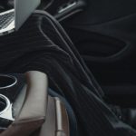 Transformational Leader - Person Seated At The Back Seat Using Macbook