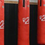 Supply Chain Risks - Interior of boxing gym with heavy punching bags hanging on chains for workout